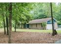 Brick home featuring an attached garage and inviting curb appeal at 1565 Earnhardt Rd, Salisbury, NC 28146