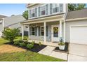 Inviting front porch with decorative plants and 'Welcome' sign, enhancing curb appeal at 3053 Riker St, Clover, SC 29710