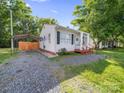 Exterior view with a carport and gravel driveway of the single-story home at 339 Arnold St, Rock Hill, SC 29730