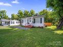 Well maintained front yard of a single-story home, and well manicured lawn at 339 Arnold St, Rock Hill, SC 29730