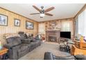 Inviting living room featuring a fireplace, plush seating, and neutral carpet at 4059 10Th Avenue Sw Dr, Hickory, NC 28602