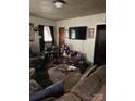 Comfortable living room with a plush sofa, large television, and ample space for relaxation at 415 N Secrest Ave, Monroe, NC 28110