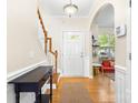 Bright foyer with hardwood floors, staircase, and an open view into the living space at 424 River Park Rd, Belmont, NC 28012