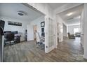 Spacious living area with modern flooring, multiple doorways, and versatile layout options for a comfortable home at 5125 Thomasville Dr, Belmont, NC 28012