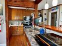 Inviting kitchen with wood cabinets, ample counter space, and a breakfast bar area at 522 W Congress St, Lincolnton, NC 28092