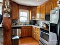 Cozy kitchen with wood cabinetry, stainless steel appliances, and a functional layout at 522 W Congress St, Lincolnton, NC 28092