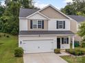 Lovely two-story home with a two-car garage, tidy landscaping, and a welcoming front entrance at 8314 Paw Valley Ln, Charlotte, NC 28214