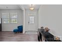 Bright foyer featuring wood-look flooring, a statement light fixture, and decorative furnishings at 9110 Buckley Ct # 154, Charlotte, NC 28269