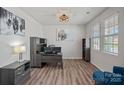 Well-lit home office space with wood-look floors and modern decor at 9110 Buckley Ct # 154, Charlotte, NC 28269