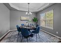Elegant dining room featuring a modern chandelier and lots of natural light at 1035 Ivey Ct, Indian Land, SC 29707