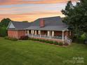 Expansive backyard with a covered porch, perfect for outdoor entertaining and relaxation at 105 Gold Run Ct, Kings Mountain, NC 28086