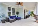 Spacious front porch with ceiling fan and cozy blue sectional sofa at 109 Mac Aly, Cramerton, NC 28032