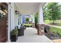 Inviting front porch with decorative columns and comfortable seating area at 109 Mac Aly, Cramerton, NC 28032