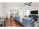 Open living room with hardwood floors, ceiling fan and adjoining dining area at 109 Mac Aly, Cramerton, NC 28032