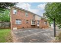 A spacious brick home featuring a large paved parking area and easy access to a back entrance at 114 Sardis Plantation Dr, Matthews, NC 28105
