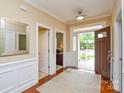 Inviting foyer boasting hardwood floors, traditional moldings, and an open view into other rooms at 11607 Meetinghouse Dr, Cornelius, NC 28031