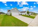 Lovely home featuring a two-car garage and long driveway in a beautiful neighborhood at 130 Slalom St, Statesville, NC 28677