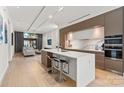 Modern kitchen boasts stainless steel appliances, waterfall island, and an open floor plan at 1620 S Tryon St, Charlotte, NC 28203