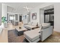Bright living room with modern décor, hardwood floors, and a seamless transition to the kitchen at 1620 S Tryon St, Charlotte, NC 28203