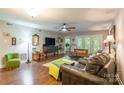 Bright living room with hardwood floors, a ceiling fan, and access to the outdoor space at 1804 Fairlawn Ct, Rock Hill, SC 29732