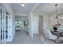 Bright foyer with light wood floors, neutral walls, and views into the living room and dining area, creating an open feel at 2000 Plainfield Dr, Bessemer City, NC 28016