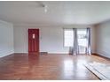 Spacious living room featuring hardwood floors, natural light, and neutral wall color at 201 Robinson Rd, Gastonia, NC 28056