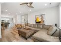 Inviting living room showcases a large sectional sofa, ottoman, and dining area adjacent at 235 S Bruns Ave, Charlotte, NC 28208