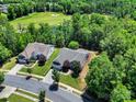 Stunning aerial view showcasing the home's landscaping near a lush golf course at 35115 Carnation Ln, Fort Mill, SC 29707