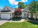 Charming home featuring stone accents, manicured landscaping, and inviting entrance at 35115 Carnation Ln, Fort Mill, SC 29707