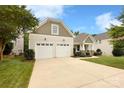 Attached two-car garage and driveway, offering ample parking space for residents and guests at 3807 Blazeprince Dr, Charlotte, NC 28215