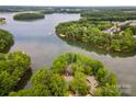 Stunning aerial perspective reveals the property's prime location near the water and lush surroundings at 449 Windward Dr, Davidson, NC 28036
