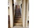 Exterior wooden staircase with white railings leading to upper level units, offering a welcoming entrance at 5003 Sharon Rd # Q, Charlotte, NC 28210