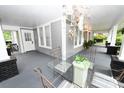 Cozy front porch showcasing outdoor seating, decorative accents, and ample natural light at 616 N Deal Ave, Newton, NC 28658