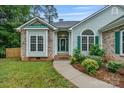 Charming single-story home with well-maintained landscaping and a welcoming entrance at 105 Stumpy Creek Rd, Mooresville, NC 28117