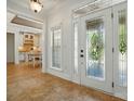 Bright entryway featuring a decorative glass front door and tiled flooring leading into the home's living spaces at 167 Logan Crossing Dr, Davidson, NC 28036