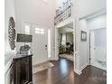 Bright foyer with high ceilings, hardwood floors, and a view into the office space at 1812 Sutter Creek Dr, Waxhaw, NC 28173