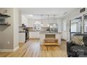 Bright kitchen with stainless steel appliances, a center island, and hardwood floors at 1821 Bonnie Ln, Charlotte, NC 28213