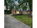 Inviting home exterior with a long driveway and beautiful sunset lighting at 2026 Knell Dr, Charlotte, NC 28212
