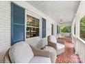 Inviting front porch with cozy seating, perfect for relaxing and enjoying the outdoors at 2112 Chatham Ave, Charlotte, NC 28205