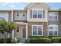 Charming townhome exterior with stone accents, tidy landscaping, and a welcoming entrance at 230 Dawn Mist Ln, Fort Mill, SC 29708