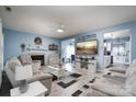 Comfortable living room featuring a fireplace, plush seating, and open layout at 240 Hillcrest Dr, Harrisburg, NC 28075