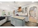 Well-equipped kitchen with stylish cabinetry, center island, pendant lighting, and modern appliances at 266 Riverwood Rd, Mooresville, NC 28117