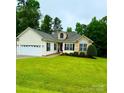 Charming single-story home featuring stone accents, manicured lawn, and attached two-car garage at 3110 Richards Way Dr, Rock Hill, SC 29732