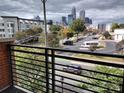 City skyline view from balcony showcasing parking, buildings, and neighborhood at 408 N Mcdowell St, Charlotte, NC 28204