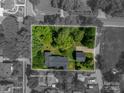 Aerial view showing approximate lot lines, surrounding trees, and home layout at 409 S Grove St, Lincolnton, NC 28092