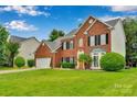 Beautiful two-story brick home with black shutters and a well-maintained front lawn at 508 Whitehead Ct # 328, Fort Mill, SC 29708