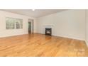 Spacious living room with hardwood floors and a cozy fireplace at 527 Livingston Dr, Lancaster, SC 29720