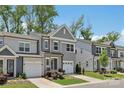 Charming two-story townhome with a well-manicured lawn and attached one car garage at 5324 Somerset Hill Ln, Charlotte, NC 28269