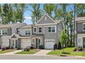 Charming two-story townhome with a well-manicured lawn, attached one car garage and sidewalk at 5324 Somerset Hill Ln, Charlotte, NC 28269