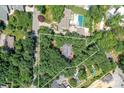 Expansive aerial view showcasing a property with mature trees and outlining the perimeter of the lot at 541 Greenway St, Davidson, NC 28036